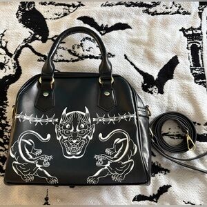 Black Satchel with White Graphic Design